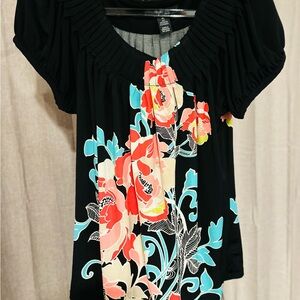 Black blouse with a vibrant orange and blue floral print by Style and Co.